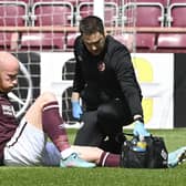 Hearts' Liam Boyce is forced off injured during the cinch Premiership match against Rangers.