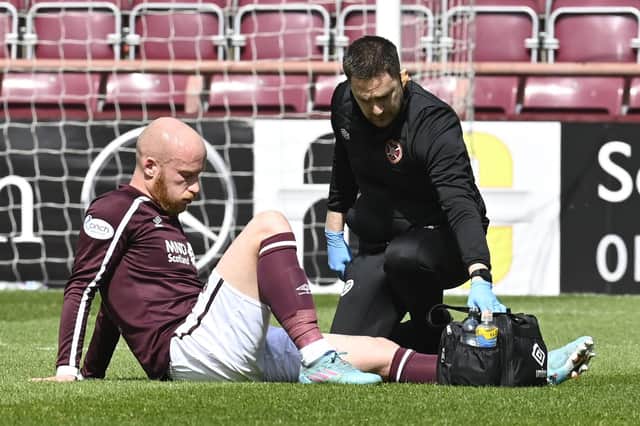 Hearts' Liam Boyce is forced off injured during the cinch Premiership match against Rangers.