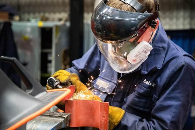 A Babcock International apprentice metal cutting.