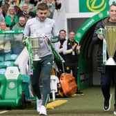 Celtic manager Brendan Rodgers and James Forrest bring out the cinch Premiership trophy and the Scottish Cup.