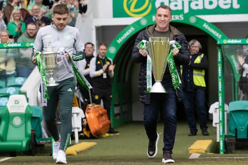 Celtic manager Brendan Rodgers and James Forrest bring out the cinch Premiership trophy and the Scottish Cup.