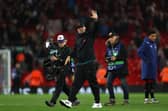 Jurgen Klopp, Manager of Liverpool acknowledges the fans after their side's victory during the UEFA Champions League group A match between Liverpool FC and Rangers FC at Anfield on October 04, 2022 in Liverpool, England. (Photo by Clive Brunskill/Getty Images)