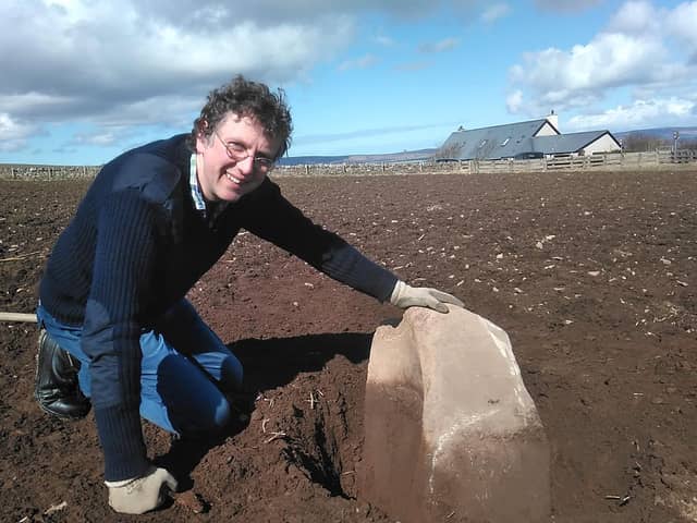 Chris Gee of the Archaeology Institute at University of Highlands and Islands with the quernstone, which was used to grind corn. The find adds more evidence to the belief that a settlement could have been made here between 3600-3200BC, hundreds of years before the world-famous Skara Brae. PIC: UHI Archaeology Institute.