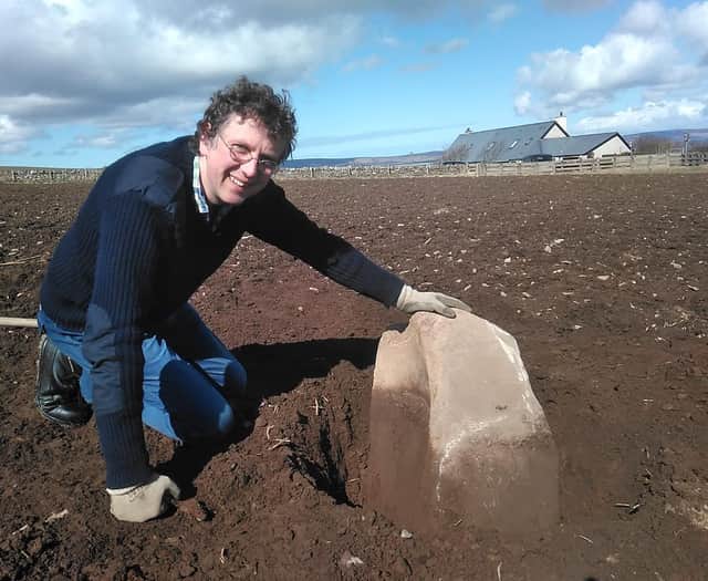 Chris Gee of the Archaeology Institute at University of Highlands and Islands with the quernstone, which was used to grind corn. The find adds more evidence to the belief that a settlement could have been made here between 3600-3200BC, hundreds of years before the world-famous Skara Brae. PIC: UHI Archaeology Institute.