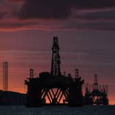 Oil rigs and drilling platforms are seen at sunrise. Picture: Peter Summers/Getty Images