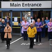 NHS workers hold a minute's silence outside the main entrance of Derriford Hospital on 28 April 2020 in Plymouth (Photo: Dan Mullan/Getty Images)