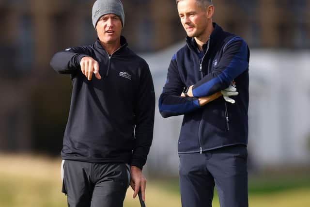 Nicolas Colsaerts and Tom Chaplin, lead singer of Keane, talk on the 17th green at St Andrews during day one of 20th Alfred Dunhill Links Championship. Picture: Richard Heathcote/Getty Images.