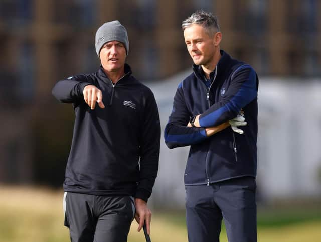 Nicolas Colsaerts and Tom Chaplin, lead singer of Keane, talk on the 17th green at St Andrews during day one of 20th Alfred Dunhill Links Championship. Picture: Richard Heathcote/Getty Images.
