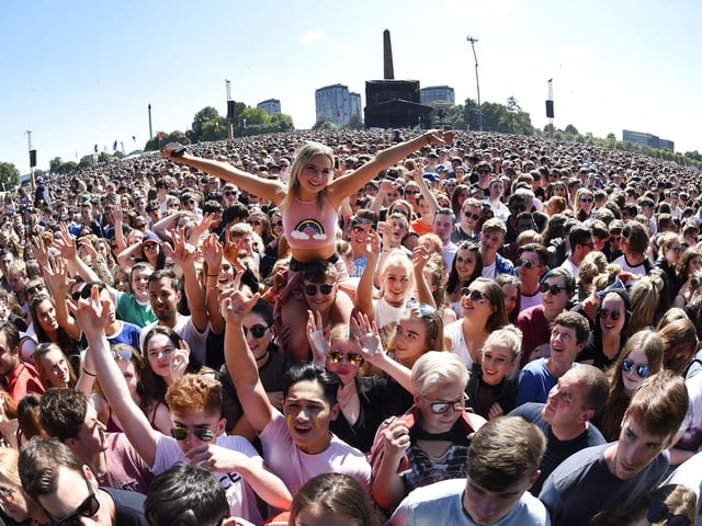 Music fans react as The Kooks perform on the main stage Photo: ANDY BUCHANAN/AFP via Getty Images)