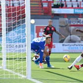 Jonathan Obika stabs the ball over the line for the only goal of the game. Picture: SNS