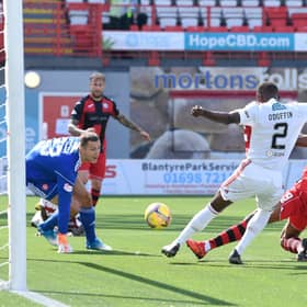Jonathan Obika stabs the ball over the line for the only goal of the game. Picture: SNS