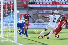 Jonathan Obika stabs the ball over the line for the only goal of the game. Picture: SNS