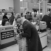 An assistant helps an elderly customer pay for her purchases using the new decimal coinage in a London supermarket on the first day of national decimalisation (Photo: Leonard Burt/Central Press/Getty Images)