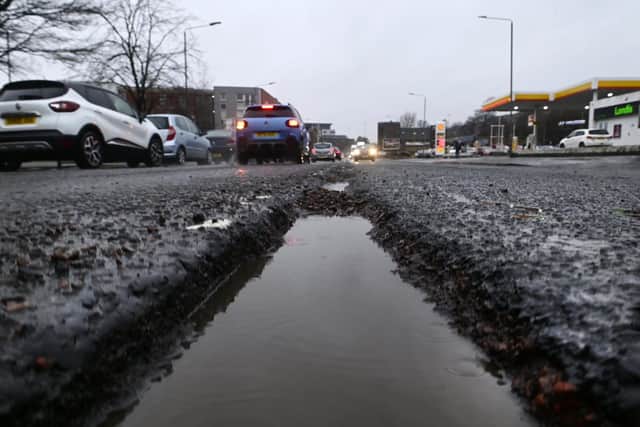 A pothole along the centre of the A8 in Alexandra Parade in Glasgow on Tuesday. (Photo by John Devlin/The Scotsman)