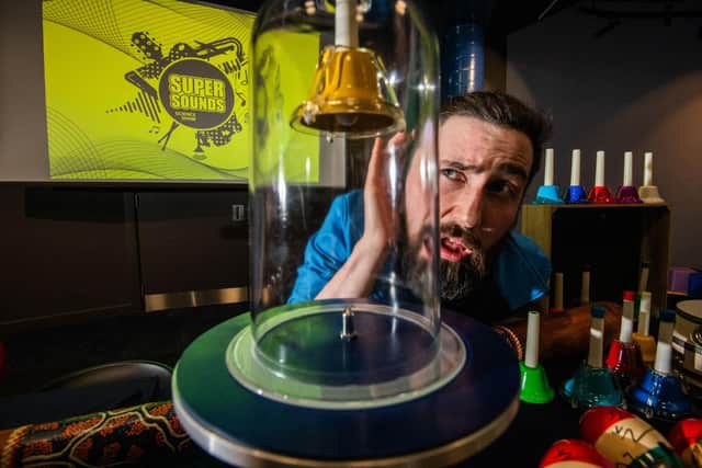 Lewis Fitzsimmons of Dundee Science Centre tunes into the bell jar