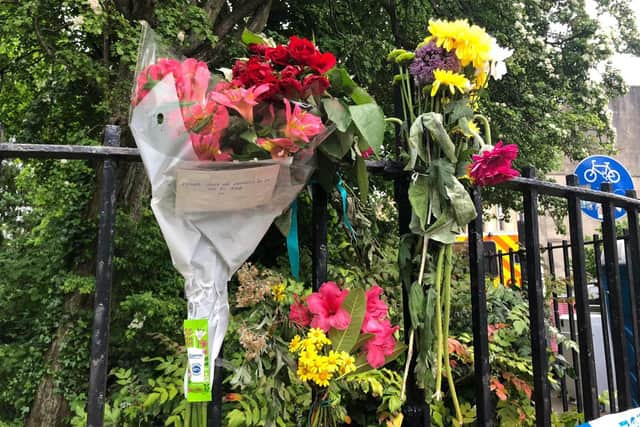 Floral tributes in West Princes Street in the Woodlands area of Glasgow following the death of pensioner Esther Brown whose body was found in her flat in suspicious circumstances.