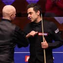 Ronnie O'Sullivan (right) bumps elbows with Anthony McGill after the Scot's victory at the Betfred World Snooker Championships at the Crucible. Picture: George Wood/PA Wire