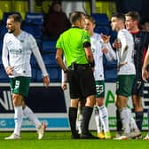 Hibs' Christian Doidge walks off after being shown a red card by referee Gavin Duncan. (Photo by Ross MacDonald / SNS Group)