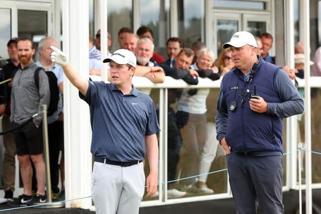 Bob MacIntyre gets a ruling during the second round of the Genesis Scottish Open at The Renaissance Club in East Lothian. Picture: Andrew Redington/Getty Images.