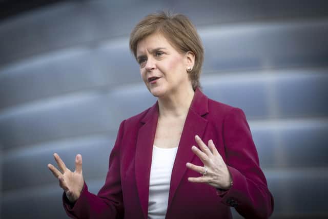 First Minister Nicola Sturgeon, leader of the Scottish National Party, speaks to the media outside the Covid 19 vaccination centre at the SSE Hydro in Glasgow while on the campaign trail for the Scottish Parliamentary election. Picture date: Saturday March 27, 2021.
