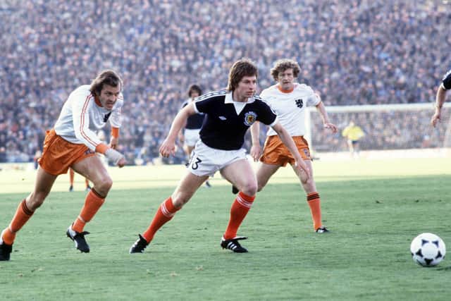 Willie Donachie in action for Scotland during their stunning but ultimately doomed 3-2 win over Holland at the 1978 World Cup. Rene van der Kerkhof, left, and Wim Jansen are the Dutch players. Picture: Colorsport/Shutterstock