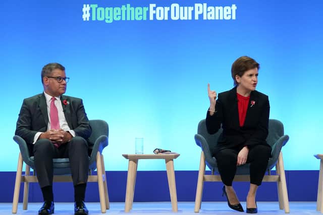 The president of COP26, Conservative MP Alok Sharma, and Nicola Sturgeon speak during an event at the United Nations' COP26 climate change summit (Picture: Ian Forsyth/Getty Images)