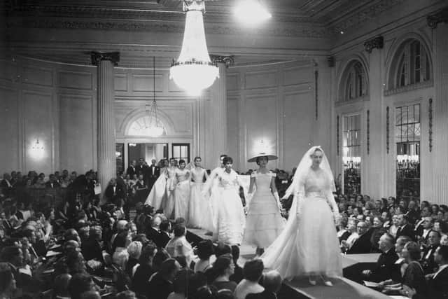 Mannequins walking down the 64 foot catwalk during the grand finale of Christian Dior's 1955 fashion show at a ball in Gleneagles. The designer insured his collection for Â£60,000 and flew 172 dresses (worth about Â£300 each), eight models, three organisers and three dressers from Paris to Scotland in order to raise money for the Friends of France which organises exchange visits for Scottish and French school children. The spectacular shows, at Glasgow and Gleneagles, proved very popular and raised Â£4,000 for the charity.  Original Publication: Picture Post - 7765 - Dior In Scotland - pub. 1955   (Photo by Thurston Hopkins/Getty Images)