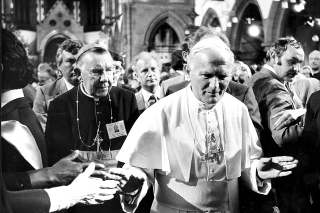 His Holiness the Pope walks through the congregation in St Mary's RC Cathedral in Broughton Place, with Cardinal Gordon Joseph Gray in the background.