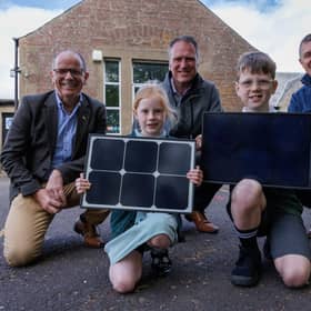 Jim Fairlie MSP, Simon Oldham Highland Spring Group managing director, Stuart Batty SSE senior project development manager, and pupils from Blackford Primary School. Picture by Nick Mailer Photography