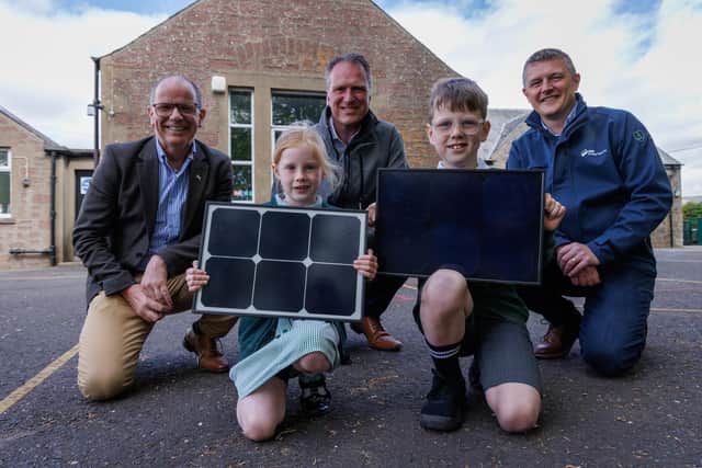 Jim Fairlie MSP, Simon Oldham Highland Spring Group managing director, Stuart Batty SSE senior project development manager, and pupils from Blackford Primary School. Picture by Nick Mailer Photography