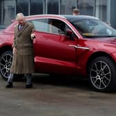 The Prince of Wales inspecting the Aston Martin DBX model during a visit to the Aston Martin Lagonda factory in Wales.