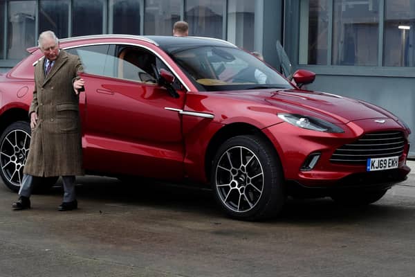 The Prince of Wales inspecting the Aston Martin DBX model during a visit to the Aston Martin Lagonda factory in Wales.