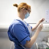 A nurse prepares a coronavirus vaccine.