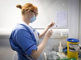 A nurse prepares a coronavirus vaccine.