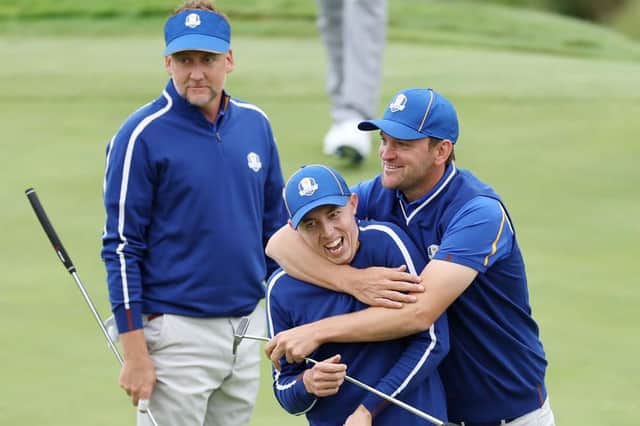 Matt Fitzpatrick gets a playful hug from Bernd Wiesberger as Ian Poulter looks on during a practice round prior to the 43rd Ryder Cup at Whistling Straits in Kohler, Wisconsin. Picture: Richard Heathcote/Getty Images.