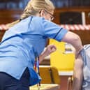 Humza Yousaf has his Pfizer vaccination jab at Caird Hall, in Dundee.