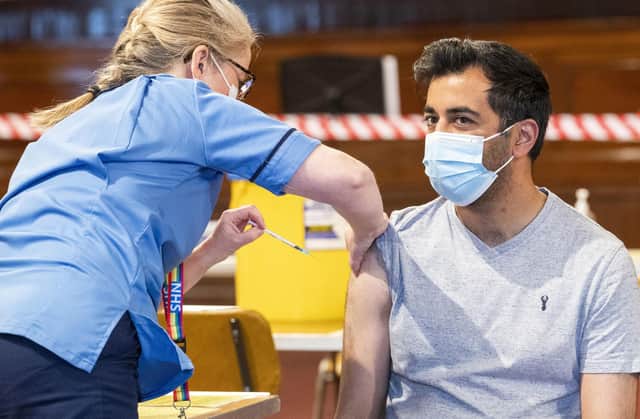 Humza Yousaf has his Pfizer vaccination jab at Caird Hall, in Dundee.