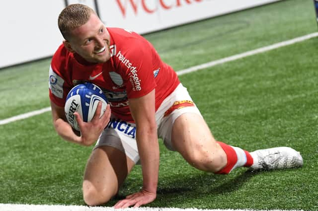 Finn Russell celebrates after scoring his try for Racing 92 against Sale Sharks.