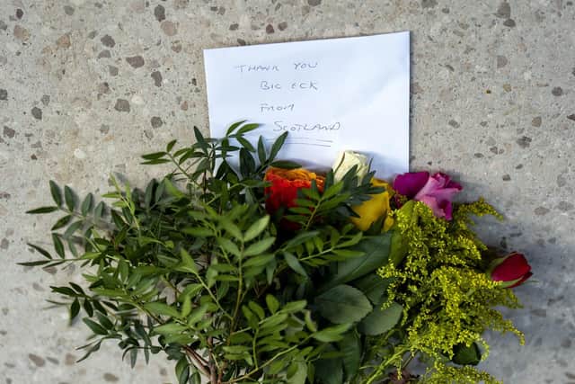 Floral tribute left outside the Scottish Parliament at Holyrood, Edinburgh, following the death of Alex Salmond.