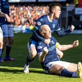 Dundee's Charlie Adam celebrates after making it 2-2 against Dundee United.