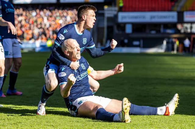 Dundee's Charlie Adam celebrates after making it 2-2 against Dundee United.