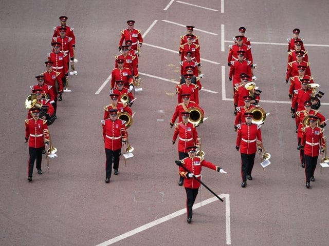 The State Gun Carriage carries the coffin of Queen Elizabeth II, draped in the Royal Standard with the Imperial State Crown