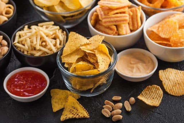 The poll found 95 per cent of people underestimated the number of calories in half a sharing packet of crisps. Picture: Shutterstock