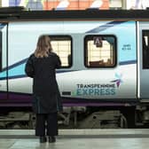 A passenger waiting for a TransPennine Express train. The operator has issued “do not travel” advice, asking customers to delay their journeys in and out of Edinburgh until after 3pm, as parts of the UK brace for high winds. Picture: Danny Lawson/PA Wire