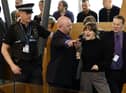 Police and security staff escort a protester from the public gallery during First Minister's Questions. Picture: Jeff J Mitchell/Getty Images