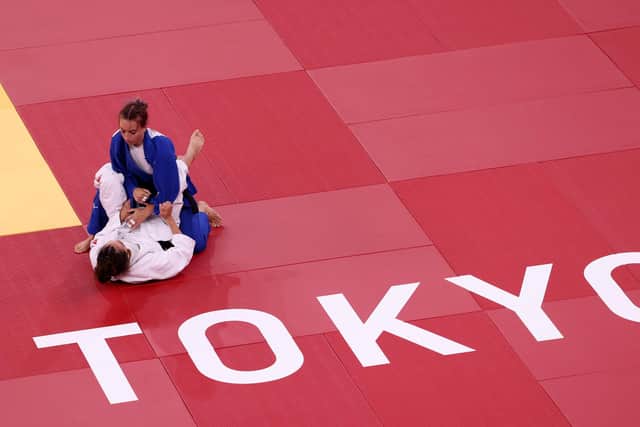 Britain's Chelsie Giles takes on Charlie van Snick oduring the women's Olympic 52kg judo repechage at Nippon Budokan in Tokyo, Japan. Picture: Leon Neal/Getty Images