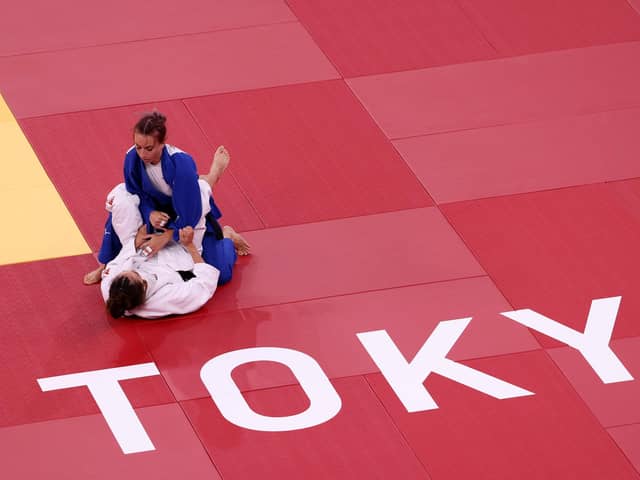 Britain's Chelsie Giles takes on Charlie van Snick oduring the women's Olympic 52kg judo repechage at Nippon Budokan in Tokyo, Japan. Picture: Leon Neal/Getty Images