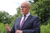 First Minister John Swinney wants Prime Minister Andy Burnham to reconsider the UK government’s block on plans by a Chinese firm to build a wind turbine factory in Scotland (Picture: Steve Welsh - Pool/Getty Images)