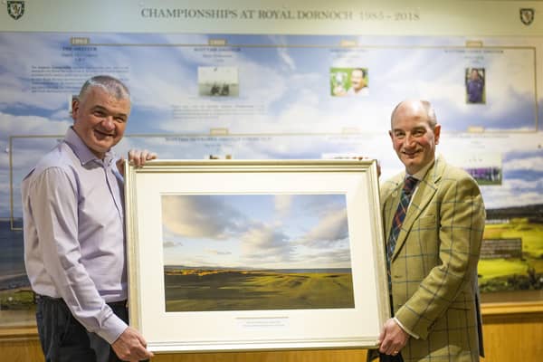 Paul Lawrie receives a framed print of the Championship Course from general manager Neil Hampton to mark being made an honorary member of Royal Dornoch. Picture: Picture: Matthew Harris