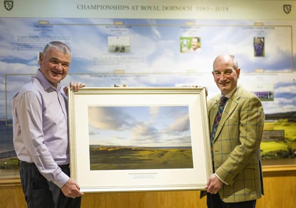 Paul Lawrie receives a framed print of the Championship Course from general manager Neil Hampton to mark being made an honorary member of Royal Dornoch. Picture: Picture: Matthew Harris